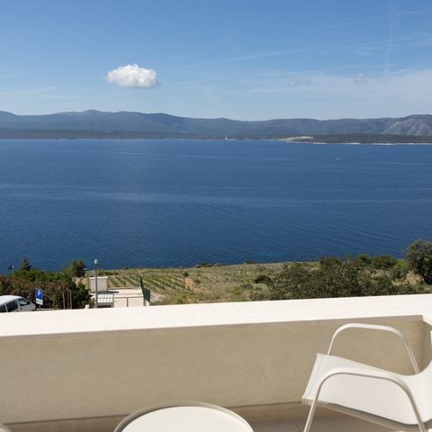 Sea view terrace with lounge chairs