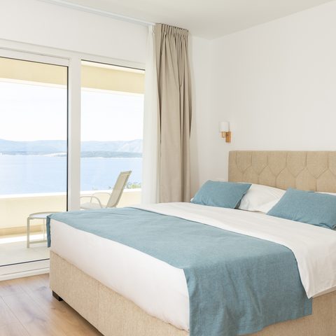 Bedroom with panoramic sea view from the bed
